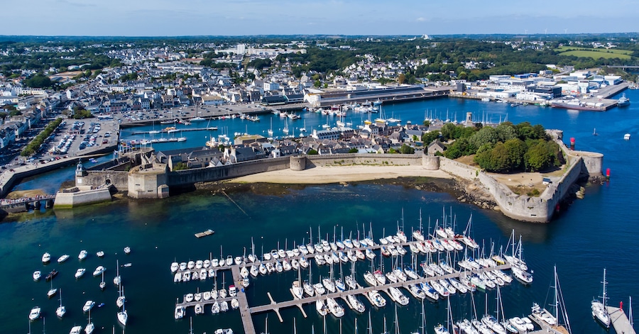 Aerial view of Concarneau, a medieval walled city in Brittany, France - Sandy beach under the fortifications of this island located in a bay along the coast of the Atlantic Ocean