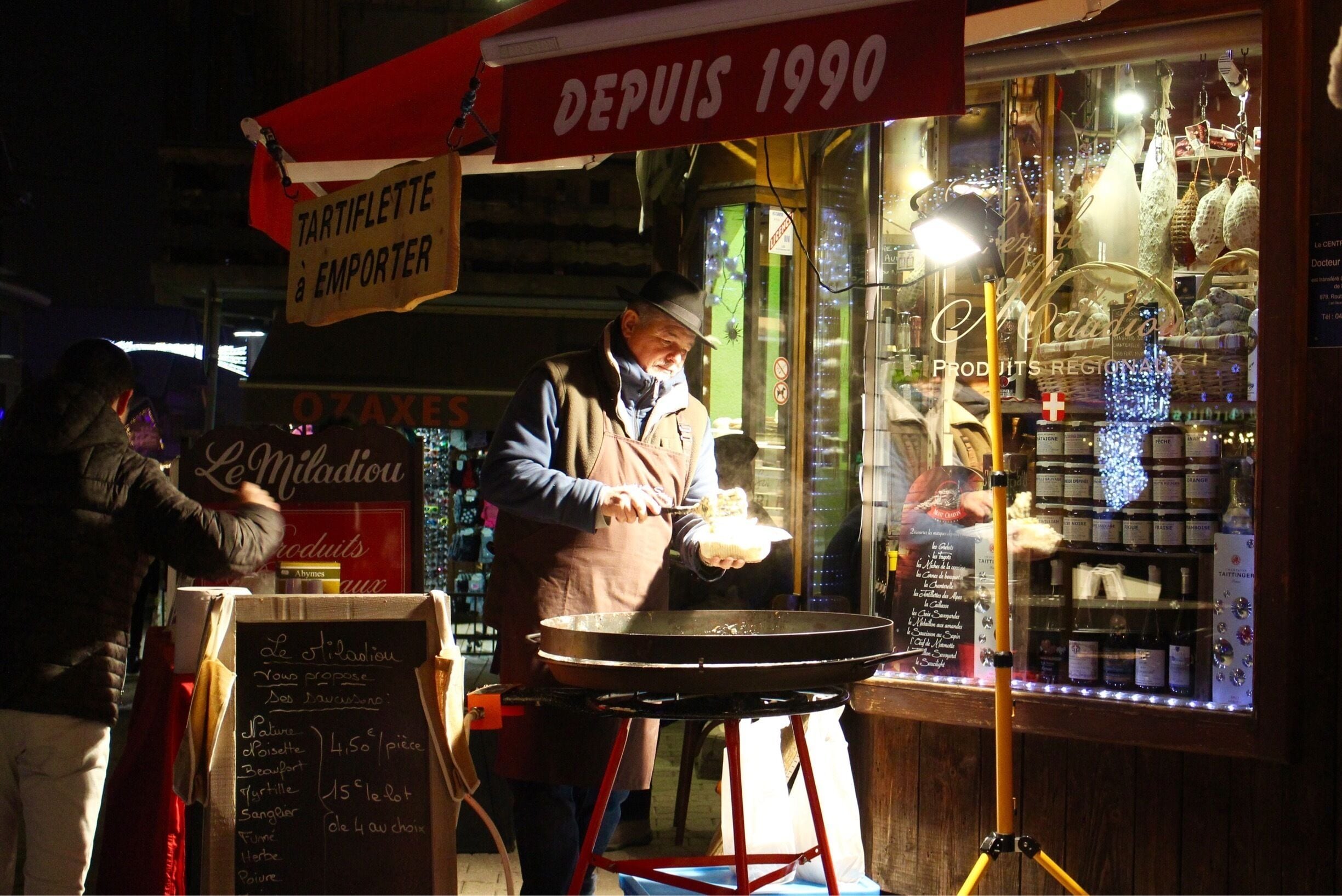 February 2015

Man serving up tartiflette at one of the many shops lining the streets of Morzine. An evening stroll around the town is great to take in the atmosphere of everything going on here.