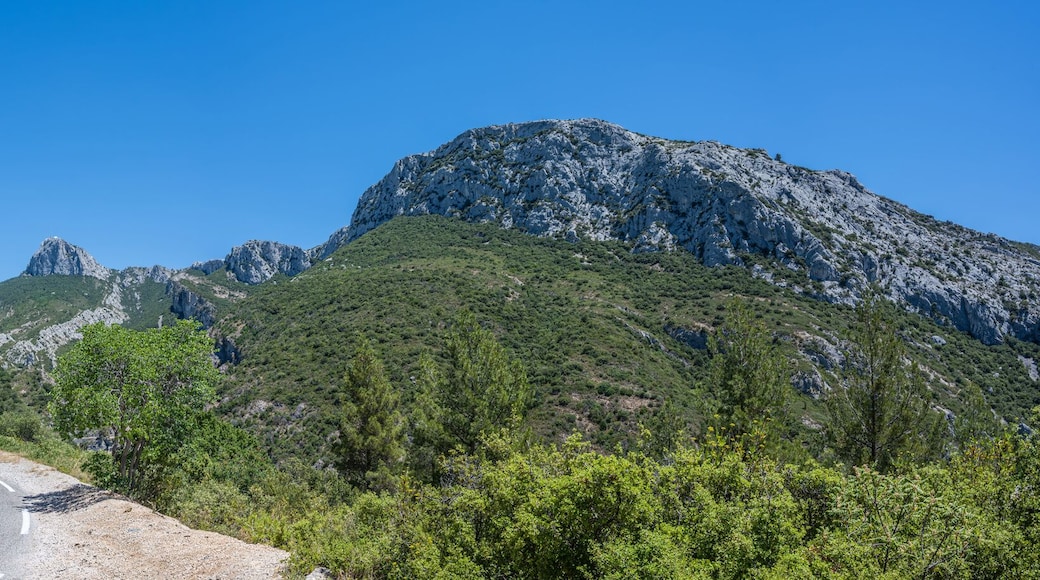 Curved mountain road and panorama view of the landscape around "vallon st pons" near Gemenos in the Bouches-du-Rhône department, Provence-Alpes-Côte d’Azur. "Pic de Bertagne" visible in background.