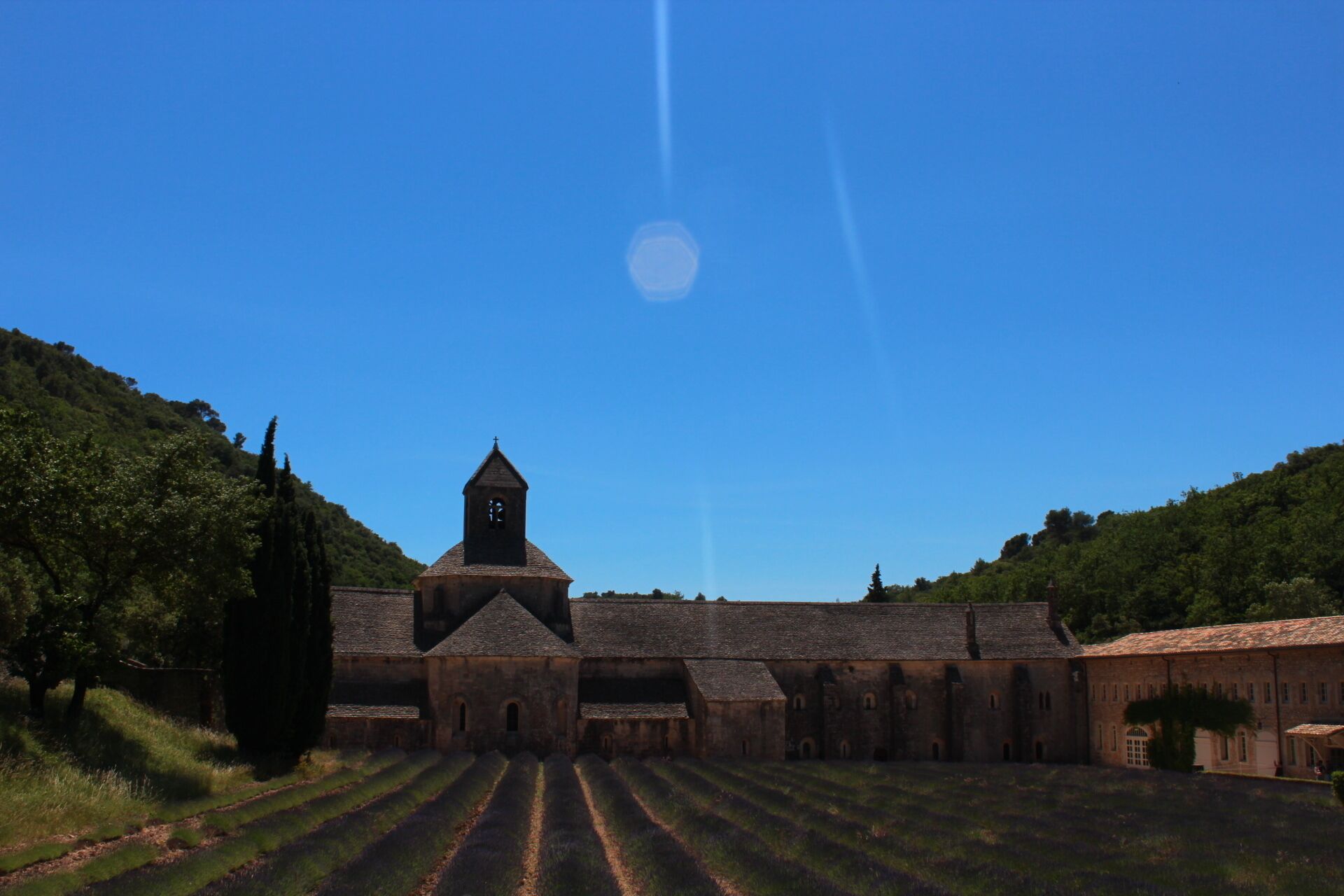 Sénanque Abbey was the highlight of my France trip. My friends and I purposely decided to make our trip around the end of June which is the start of the lavender season. Good enough they were in bloom in the region!

Sénanque Abbey is a Cisterian abbey where the monks who live there tend bees and grow lavender. The abbey houses people who wants to do spritiual retreats. Visitors are welcome to tour the inside but they should have the correct dress code. There is a poster in the front door for guidelines. Beside the entrance is the shop where they most likely sell the goods from the raw products that the monks produced.