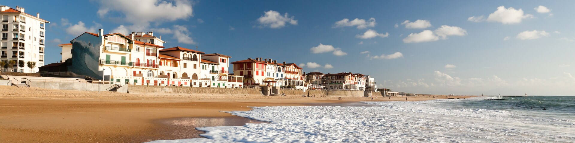 A large white water wave sliding on the Hossegor beach - France