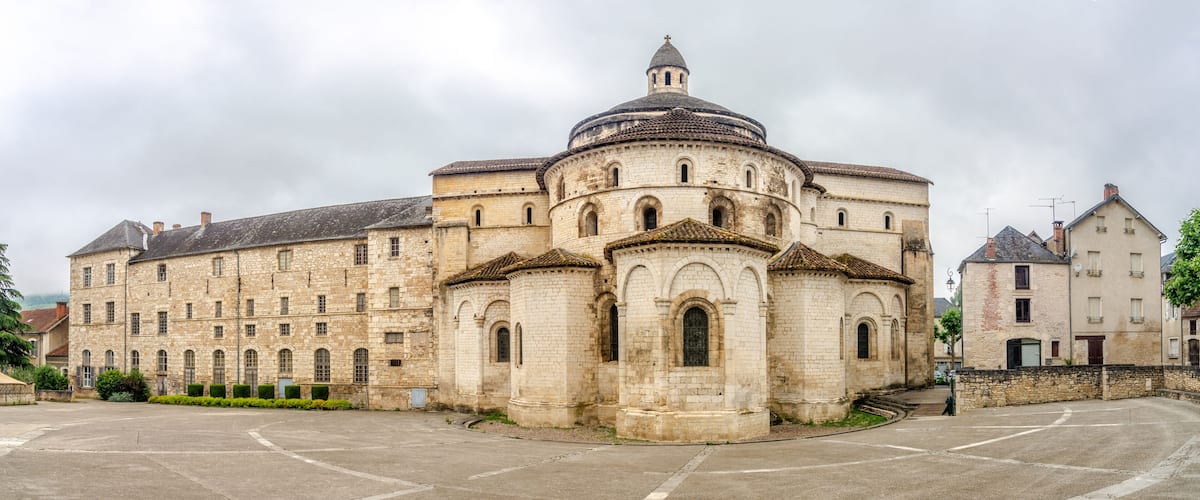 A historic building with a prominent dome and arched windows.