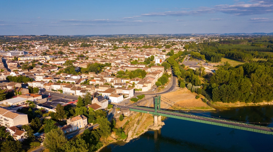Panoramic aerial view of Marmande city on Garonne river on sunny summer day, Gironde, France