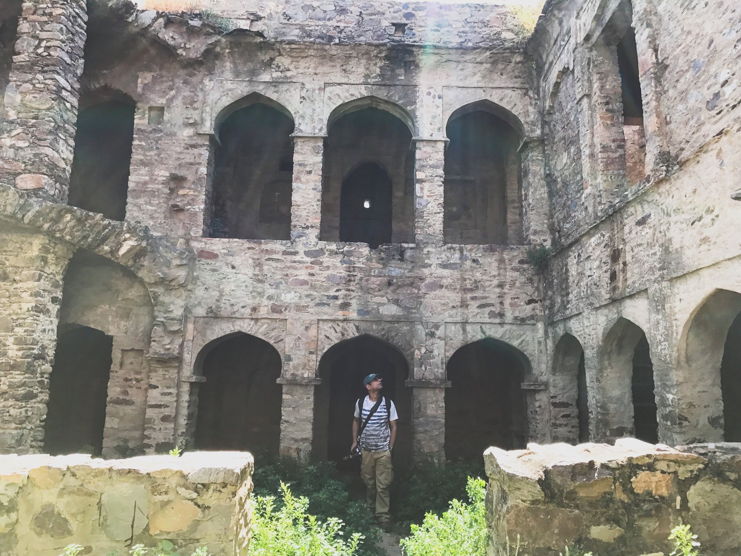 The haunted and dilapidated fort in Bhangarh village about 3 hrs from the city of Jaipur. That is my husband trying to hunt some ghost at one of the portions of the fort with the overhead sun above. 😁👻☠️😬 #bhangarhfort #jaipur #rajasthandiaries #InStone
