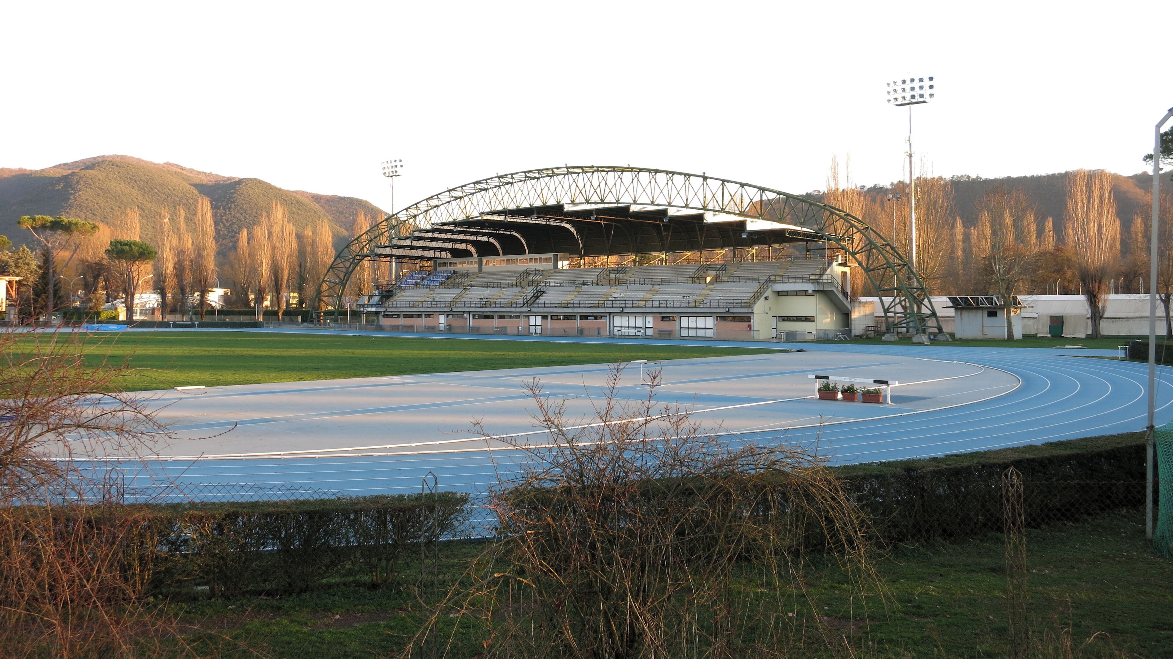 The "Velino" grandstand as seen from the embankment of the Velino river - Stadio Raul Guidobaldi, athletics venue in Rieti, Lazio, Italy