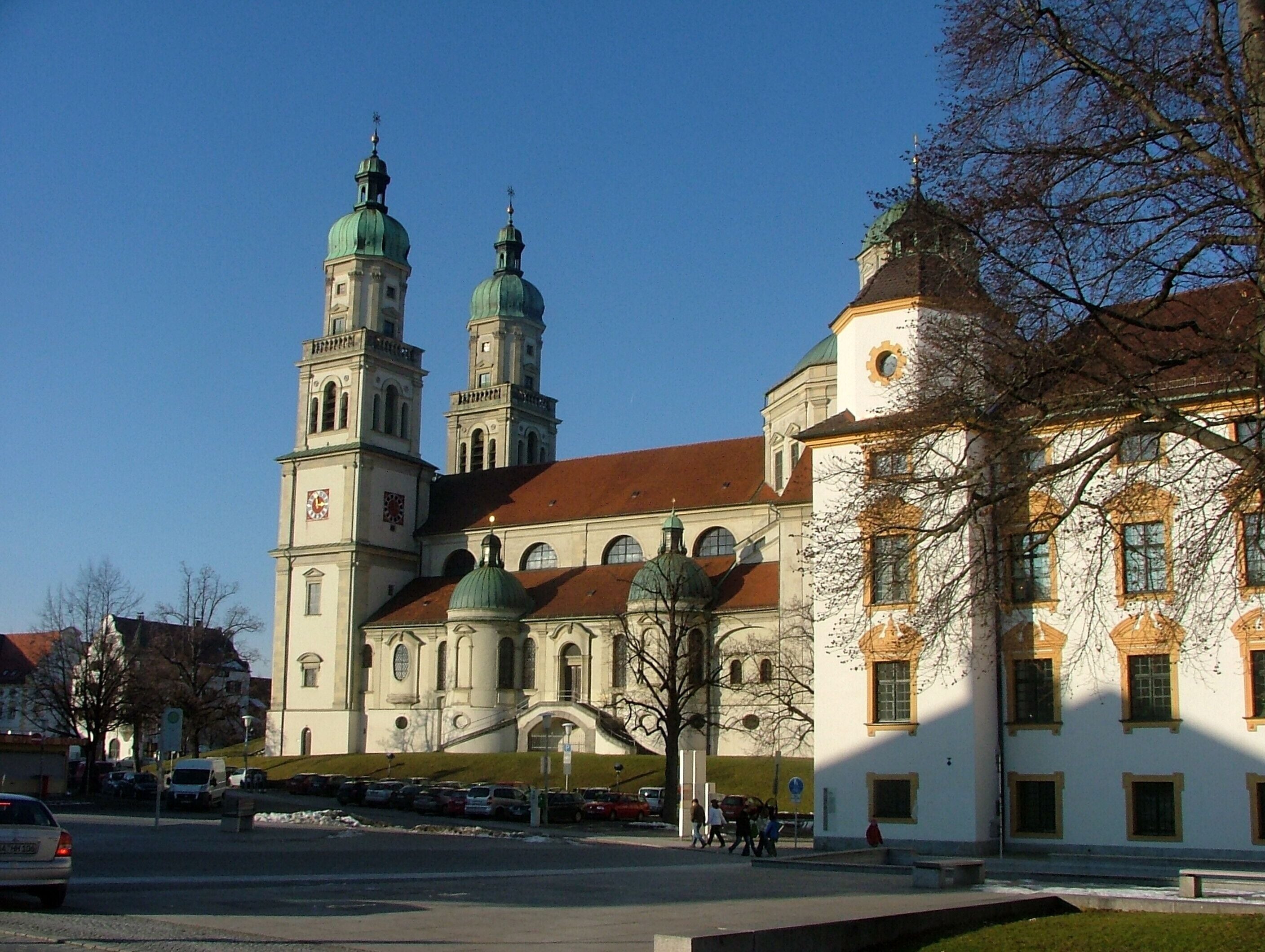A historic church with two prominent towers and a large dome.