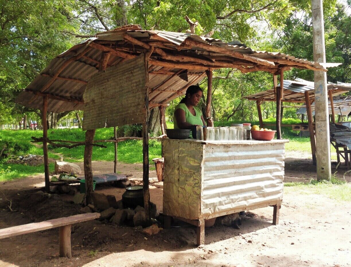As we walked 12km along the roads of Anuradhapura, we felt too tired. Fortunately, this poor looking shop was there. Though the appearance is so, Orange juice made by this lady is delicious. It completely reduced our thirst and tiresome nature. 

People in these poor villages prefer to do these kind of shops in order to earn something more. Their principal way of earning is agriculture. But it's really difficult to overcome the battle of living as they don't have enough money even to buy primary necessities.  

