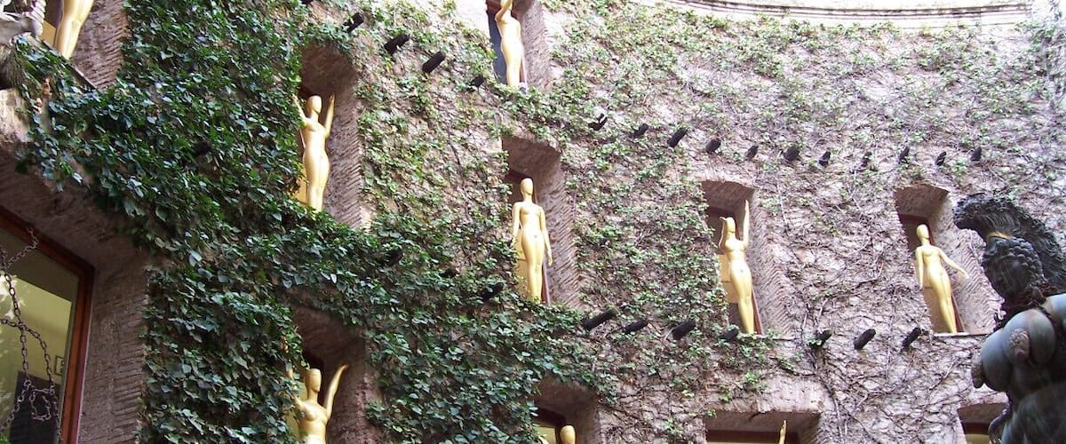 Statues inspired by the Oscars, decorating the windows of the Dali Theatre-Museum.