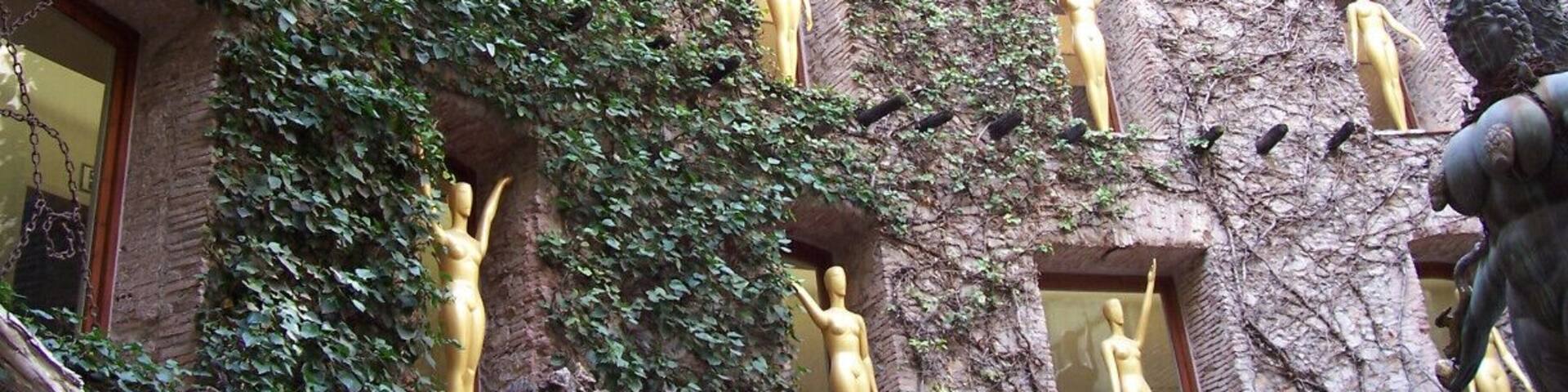 Statues inspired by the Oscars, decorating the windows of the Dali Theatre-Museum.