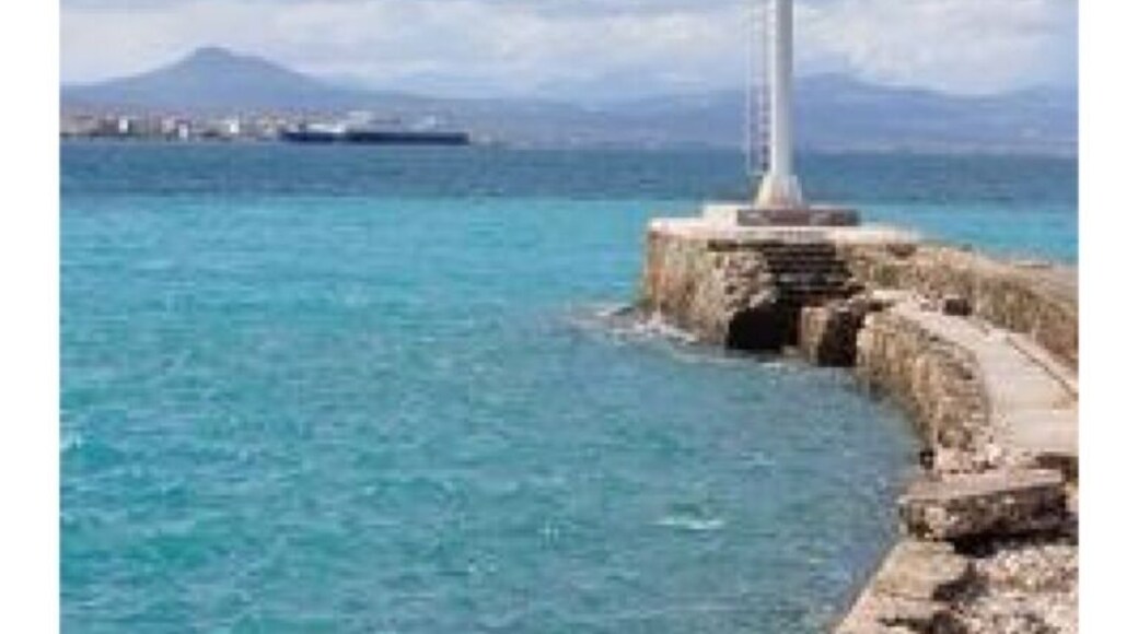 Standing at the mouth of the canal on the Gulf of Corinth.