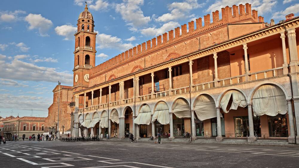 Faenza, Ravenna, Emilia-Romagna, Italy: Piazza del Popolo (People's Square) with the characteristic double porch on the facade of the medieval palace in the city famous for the artistic ceramics