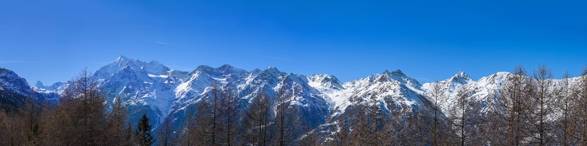 Panorama of Swiss Alps mountain chains with Weissmies, Laggin-, Fletsch-, Balfrin- oder Bietschhorn peaks viewed from Hannigalp, Grachen