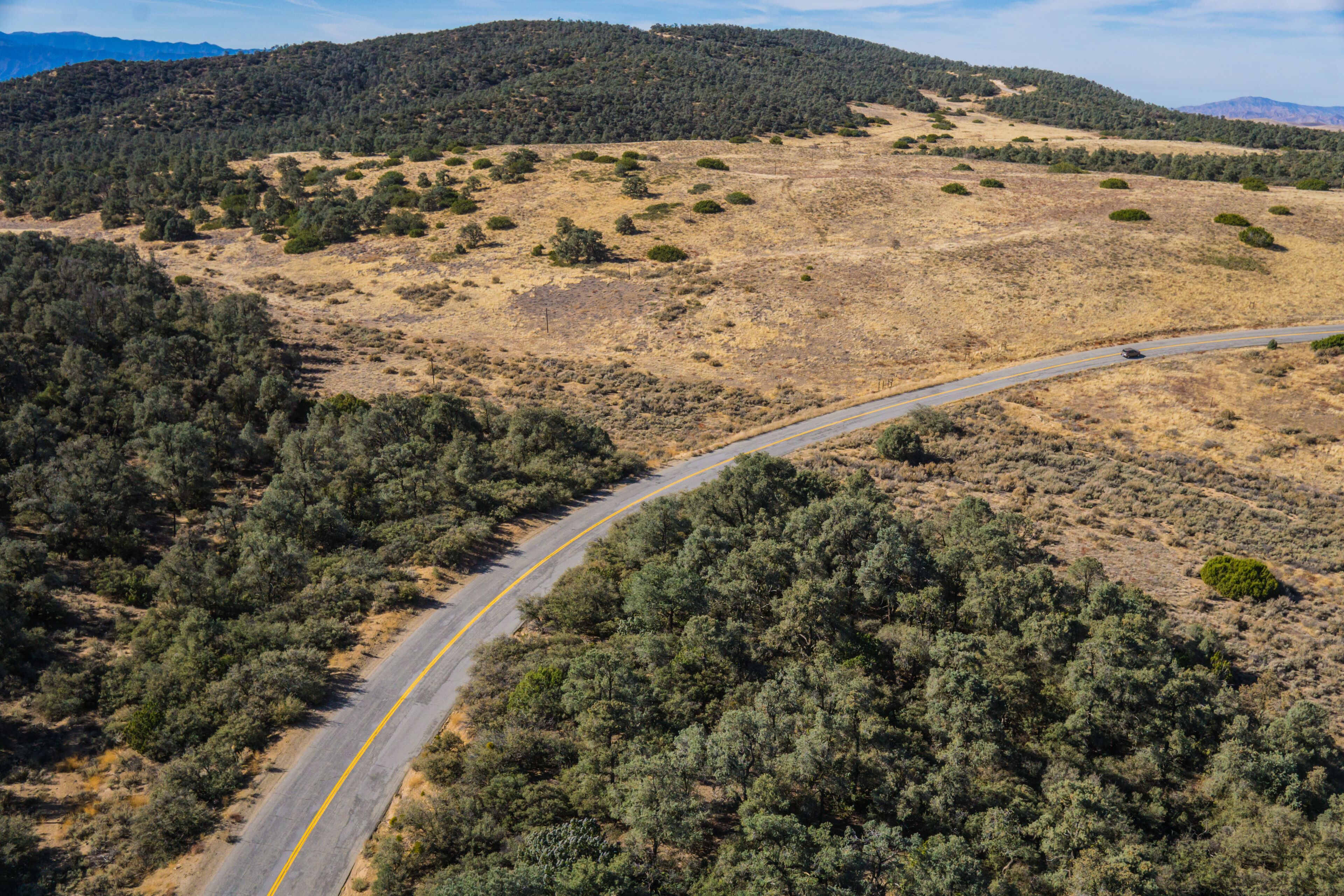 Long right turn bend in California road through public land in the Los Padres National Forest.