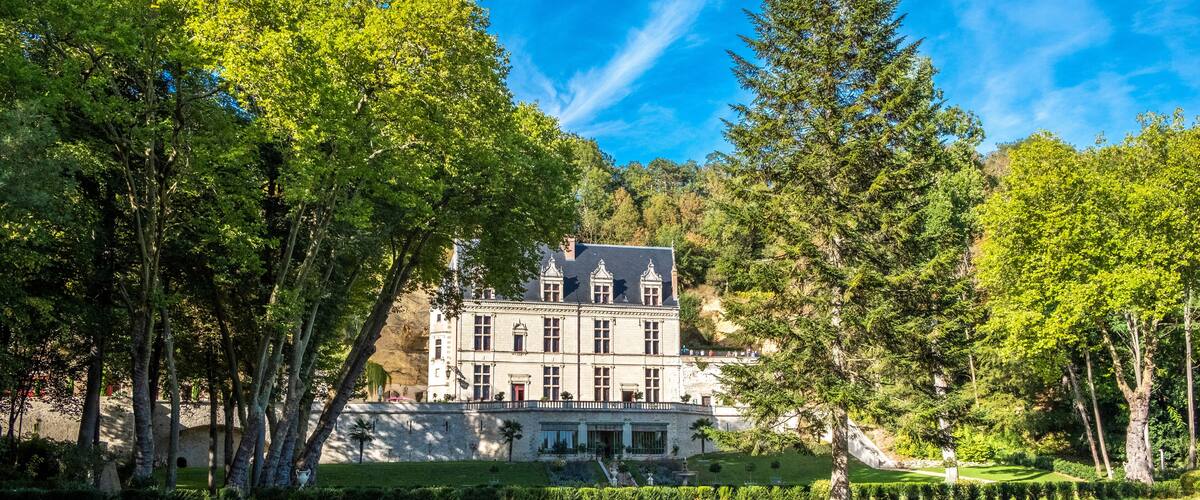 Chateau Gaillard Amboise surrounded by beautiful forest park with renaissance garden on the foreground. Loire valley, France.