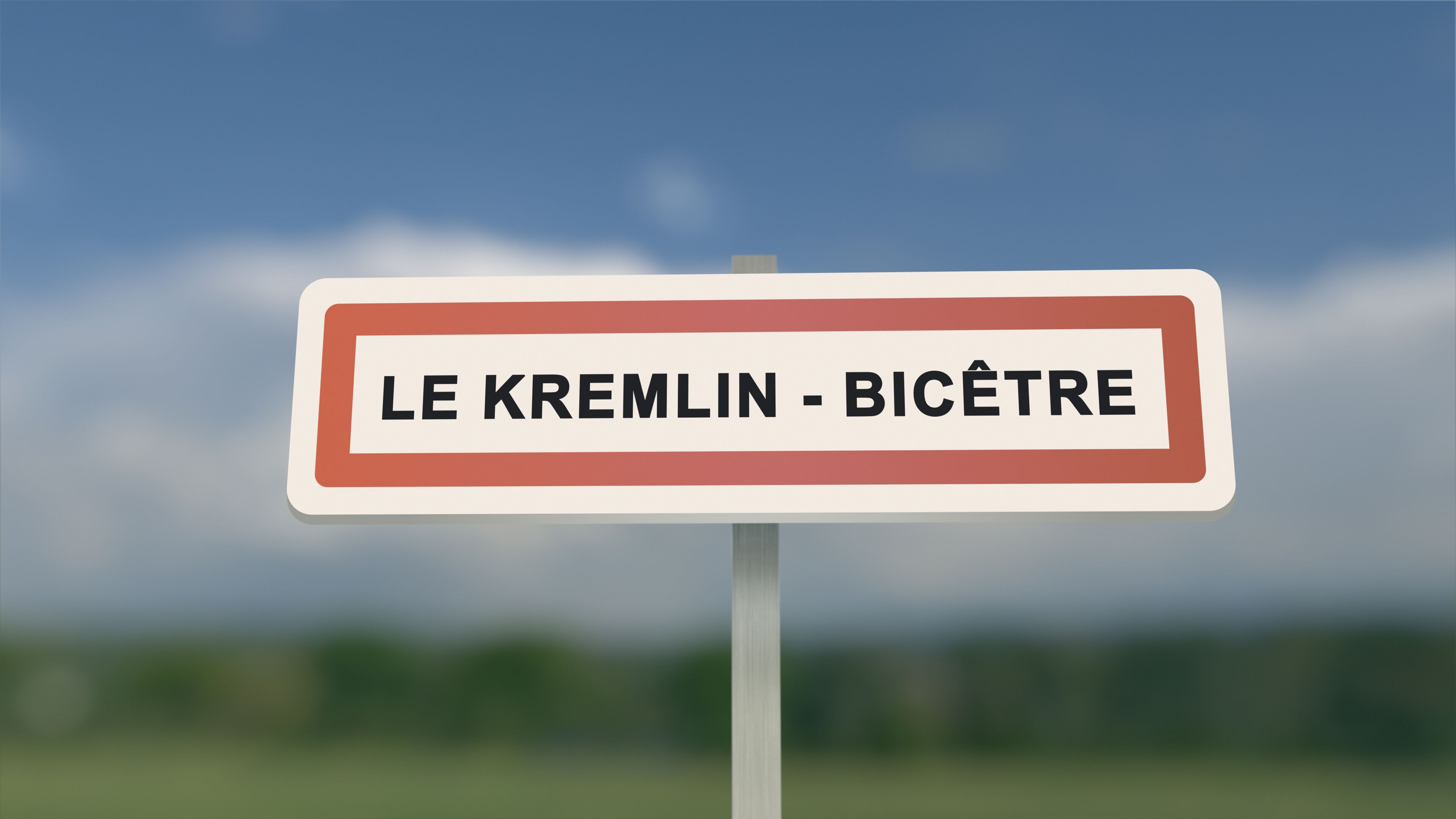 A road sign with 'LE KREMLIN - BICÊTRE' written on it.