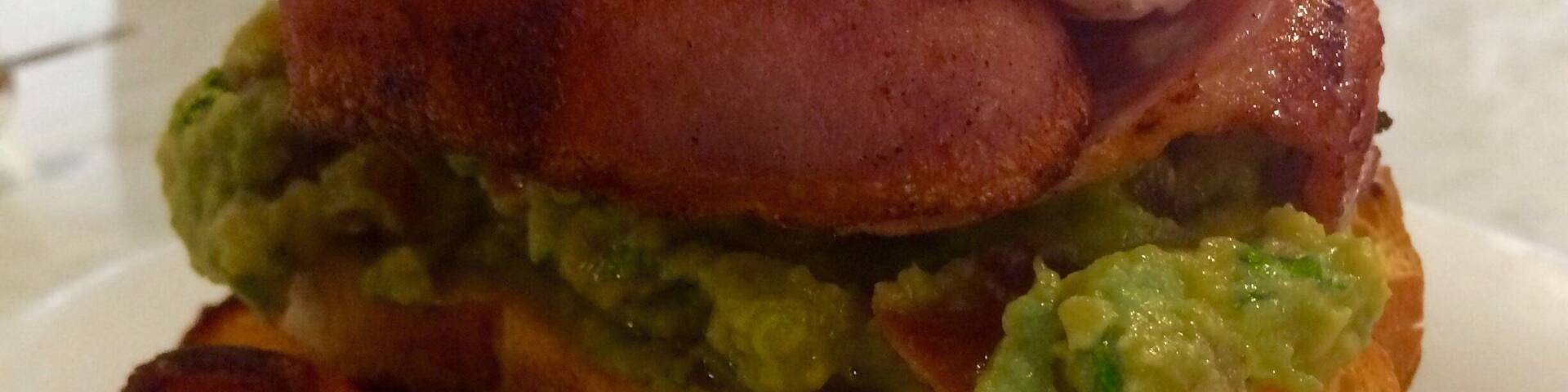 Yummy smashed avo poached egg and maple bacon $20+