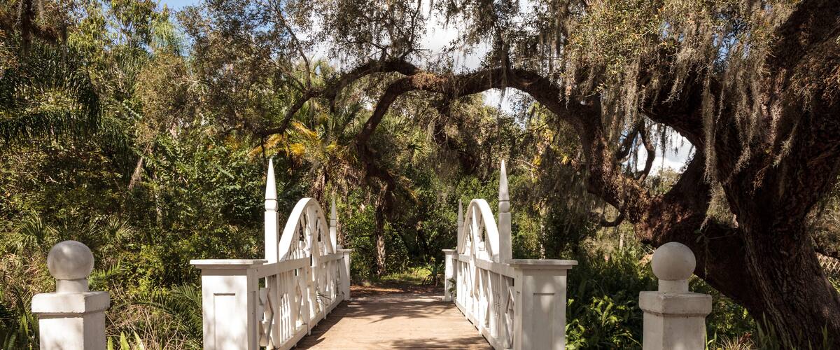 Old wooden bridge along the riverway at historic Koreshan State Park.