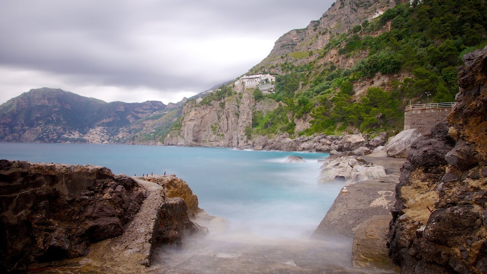 Praiano featuring mist or fog, general coastal views and rugged coastline