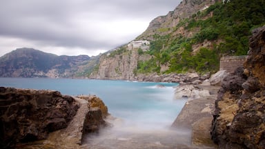 Praiano which includes general coastal views, mist or fog and rocky coastline