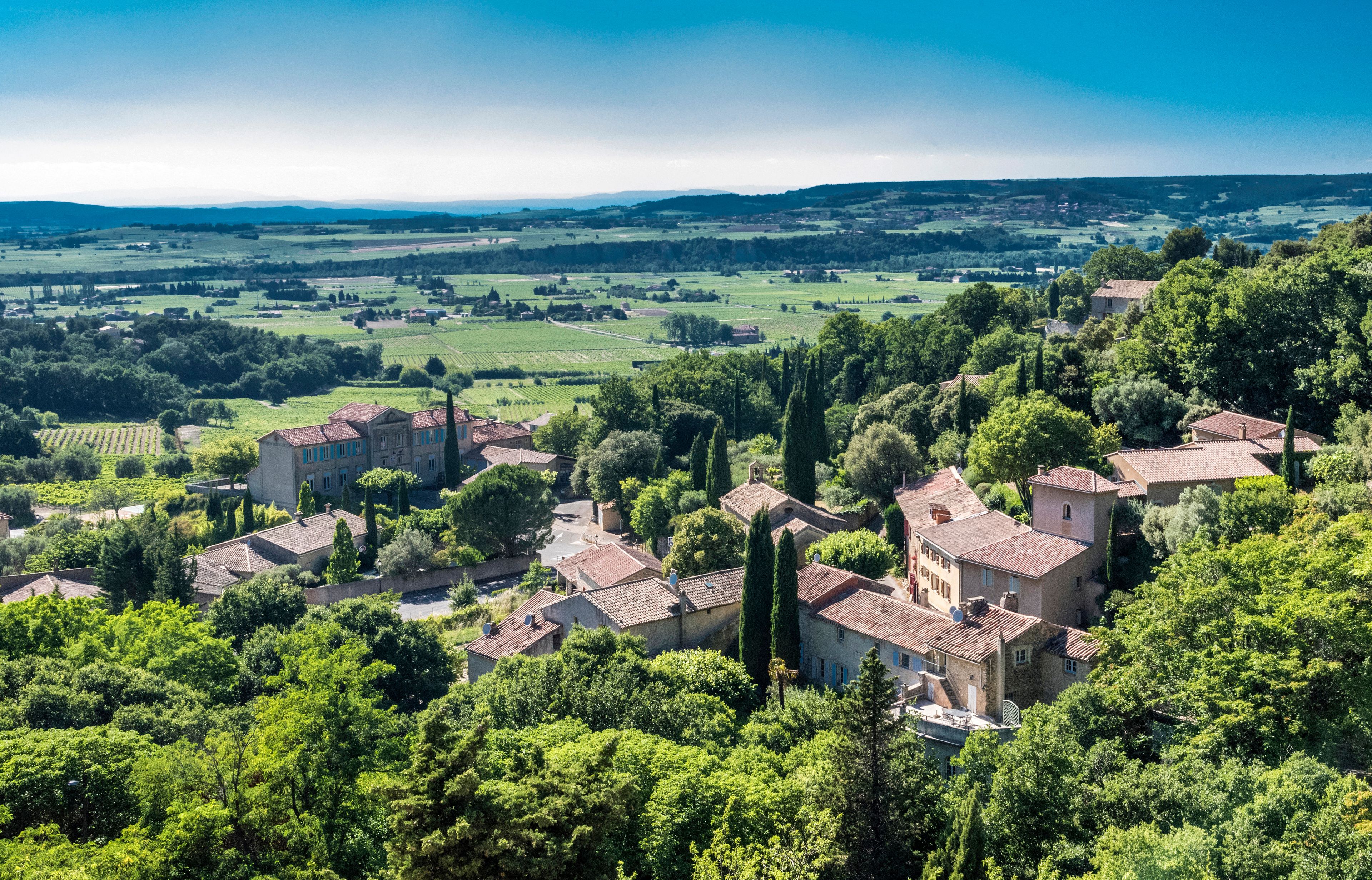 France, Vaucluse, plunging view over the perched village of Seguret (Plus Beau Village de France - Most Beautiful Village of France) (Camino de Santiago) and the Rhone valley