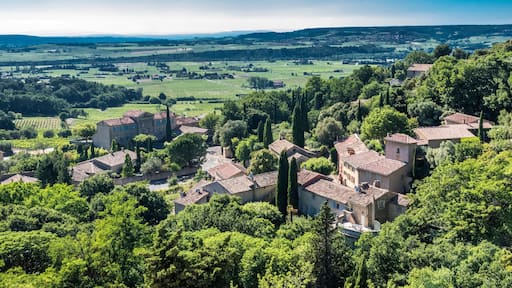 France, Vaucluse, plunging view over the perched village of Seguret (Plus Beau Village de France - Most Beautiful Village of France) (Camino de Santiago) and the Rhone valley