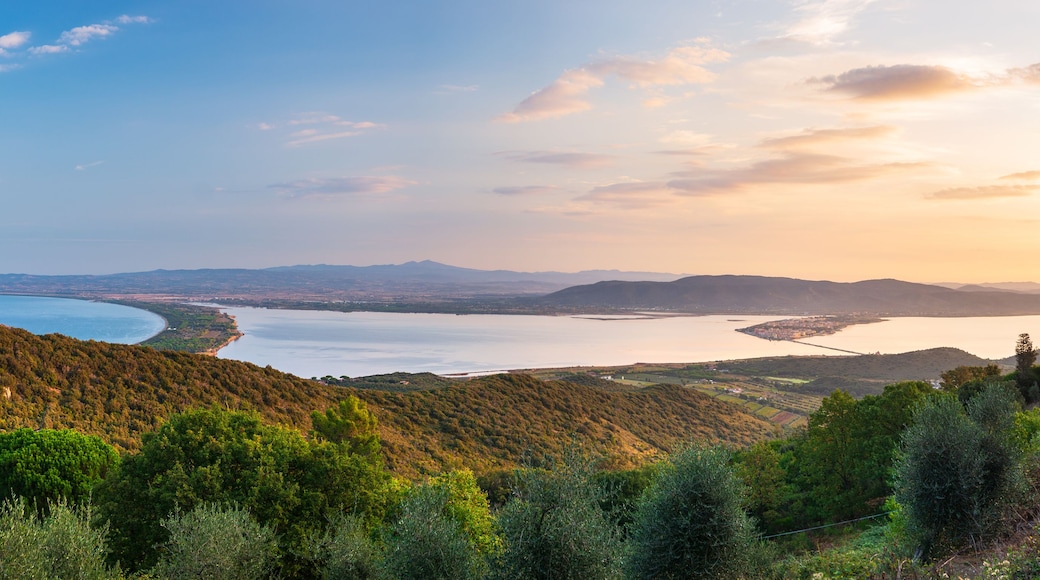 Sunrise landscape at Orbetello lagoon natural park, beautiful sky scenic coast aerial view from Monte Argentario, tourism destination Tuscany Italy