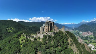 The Sacra di San Michele (Saint Michael's) Abbey, Turin, Italy, shot aerial with mountains of Susa valley in background. Aerial view