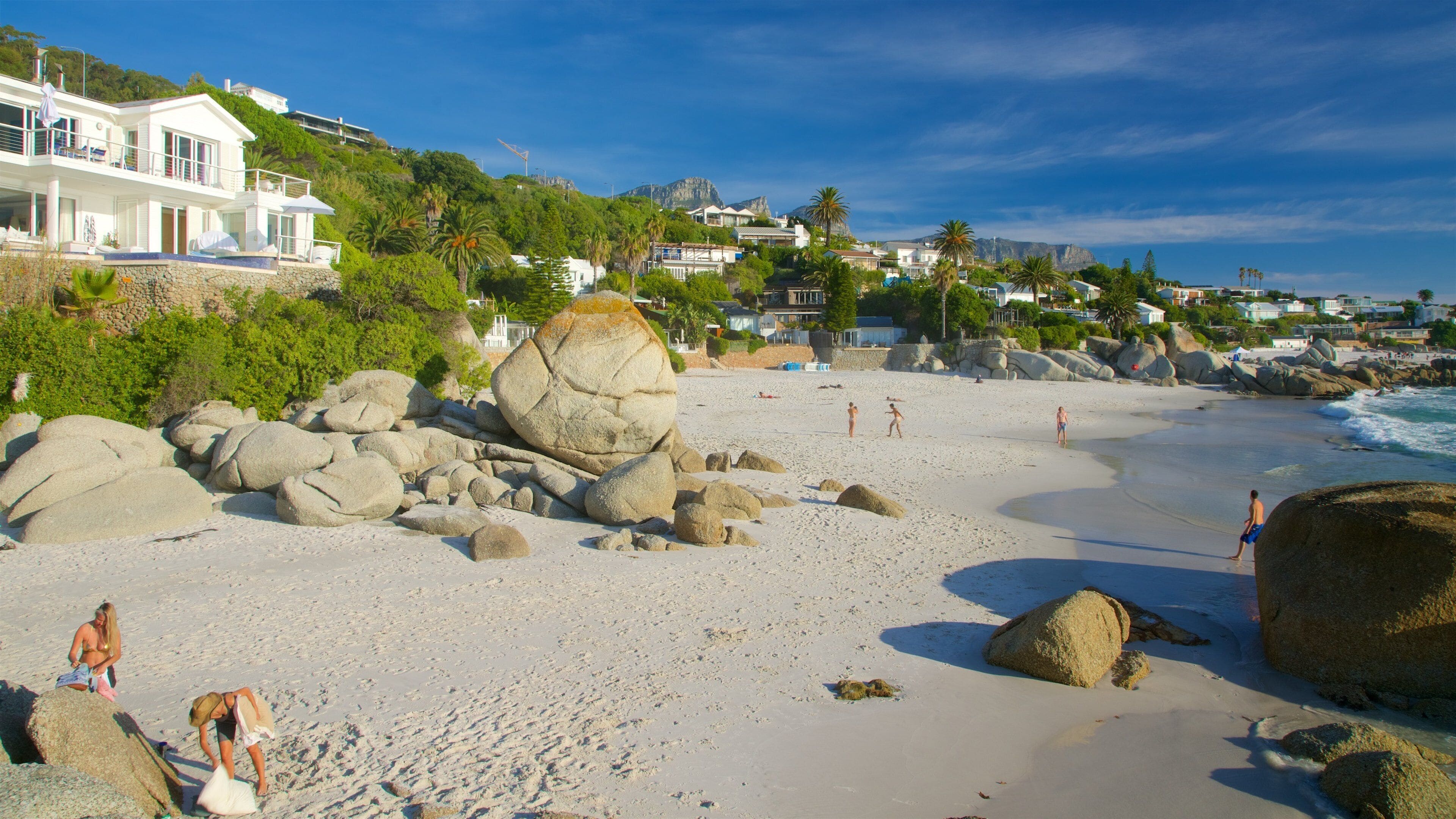 Clifton which includes a coastal town, general coastal views and a sandy beach