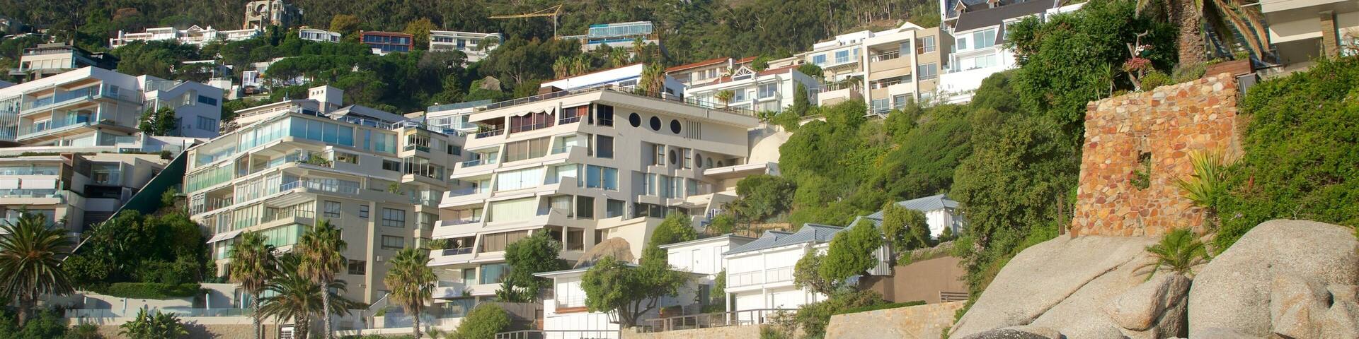 Clifton featuring a sandy beach and a coastal town