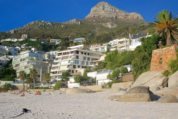 Clifton featuring a sandy beach and a coastal town