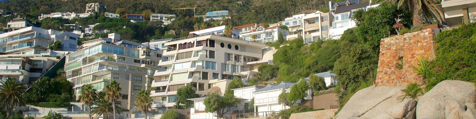 Clifton featuring a sandy beach and a coastal town