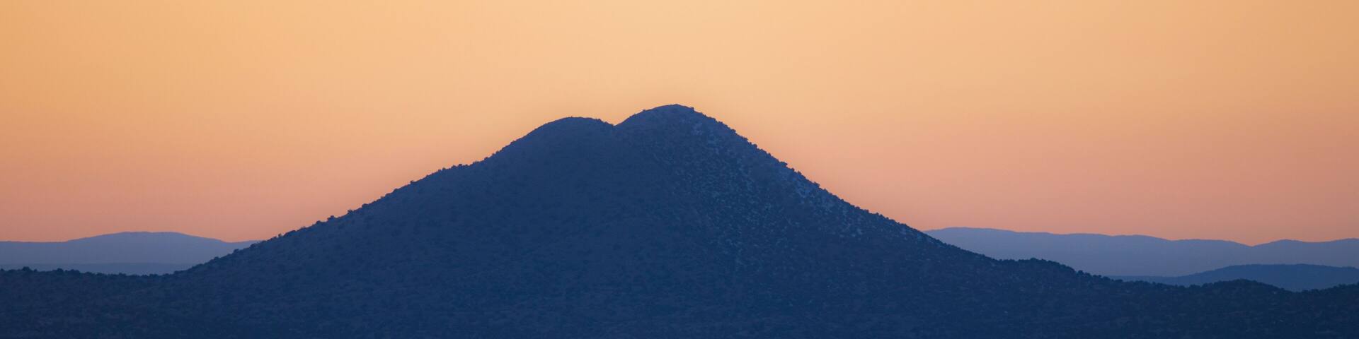 EVENING LIGHT OVER THE CERRILLOS, FROM GALISTEO BASIN PRESERVE, LAMY, NM, USA