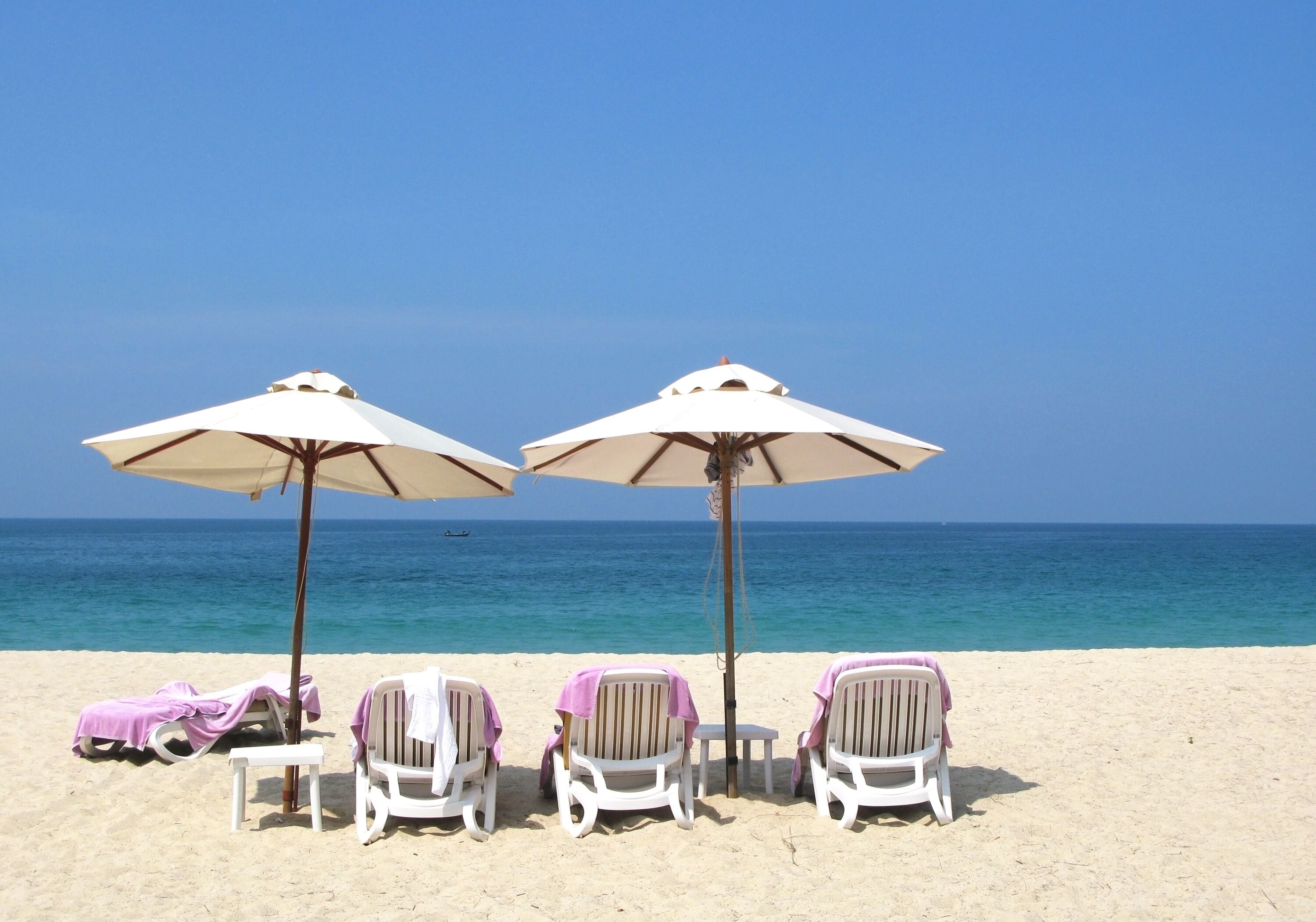 Sun umbrellas and chairs on the Bang Tao beach of Phuket island