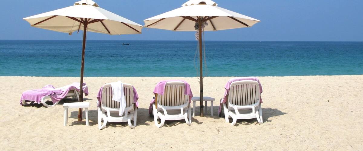 Sun umbrellas and chairs on the Bang Tao beach of Phuket island