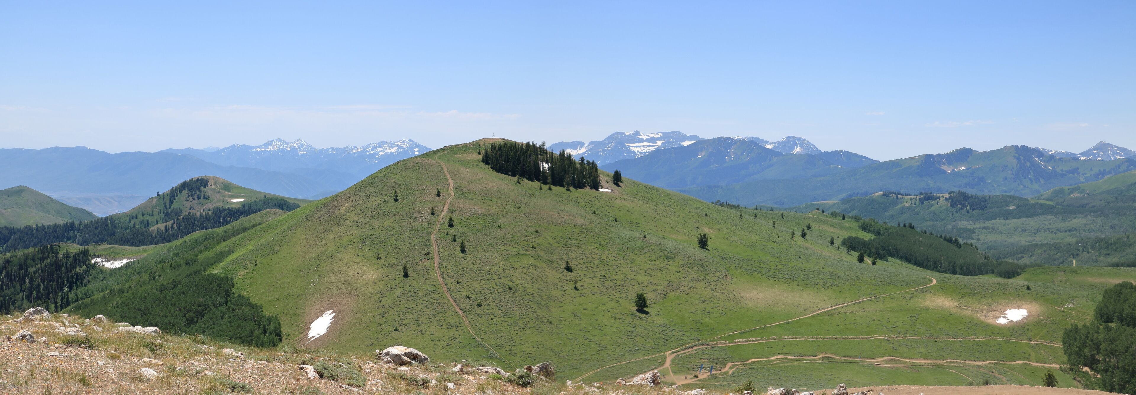 Mt Timpanogos and it's snow covered slopes are seen from Deer Valley ski resort in mid June