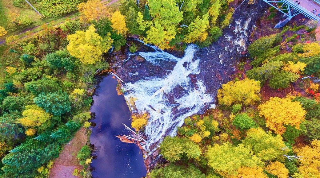 Aerial View of Eagle River Falls Amidst Autumn Foliage in Michigan
