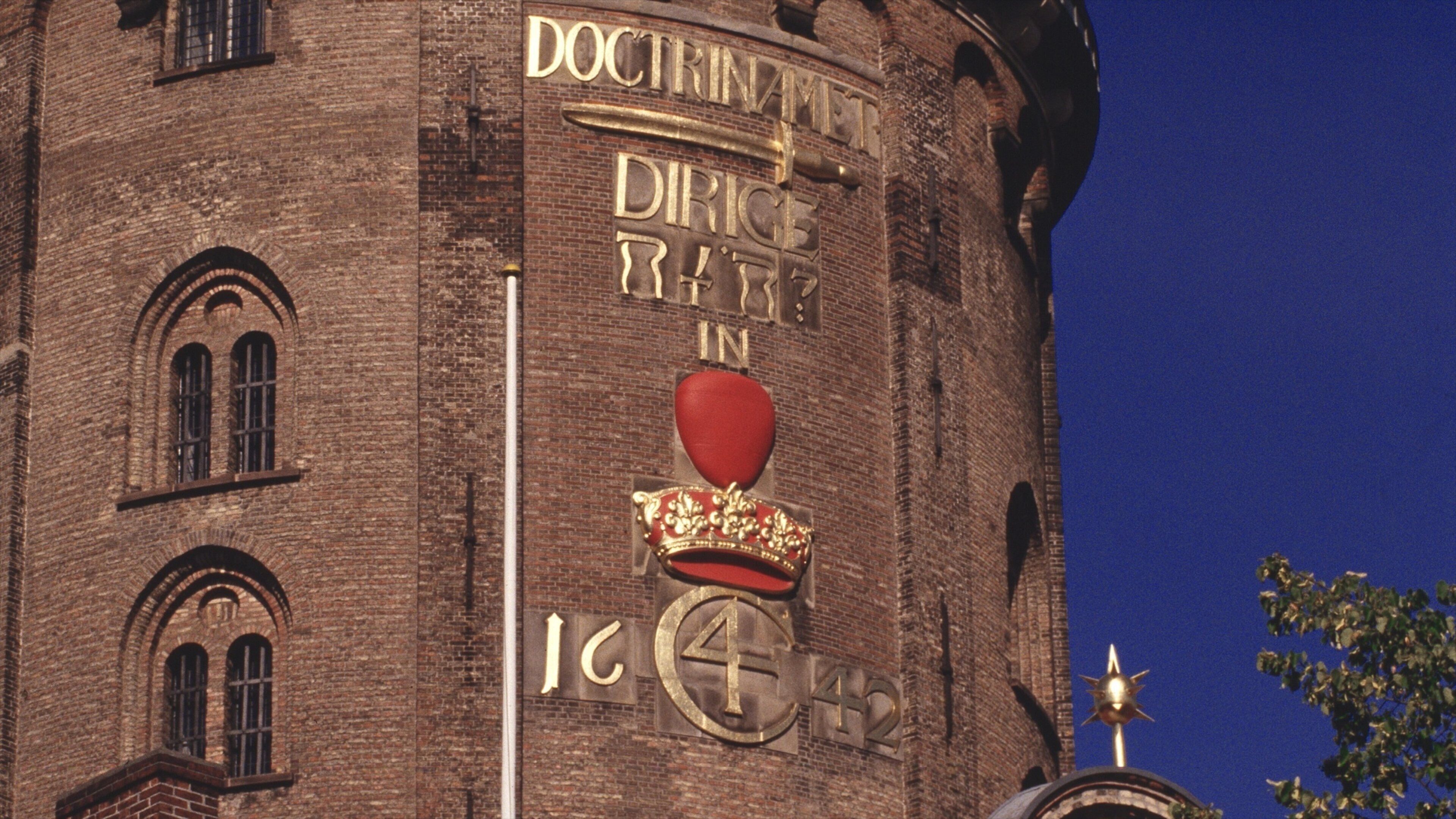Round Tower featuring heritage architecture, an administrative buidling and signage