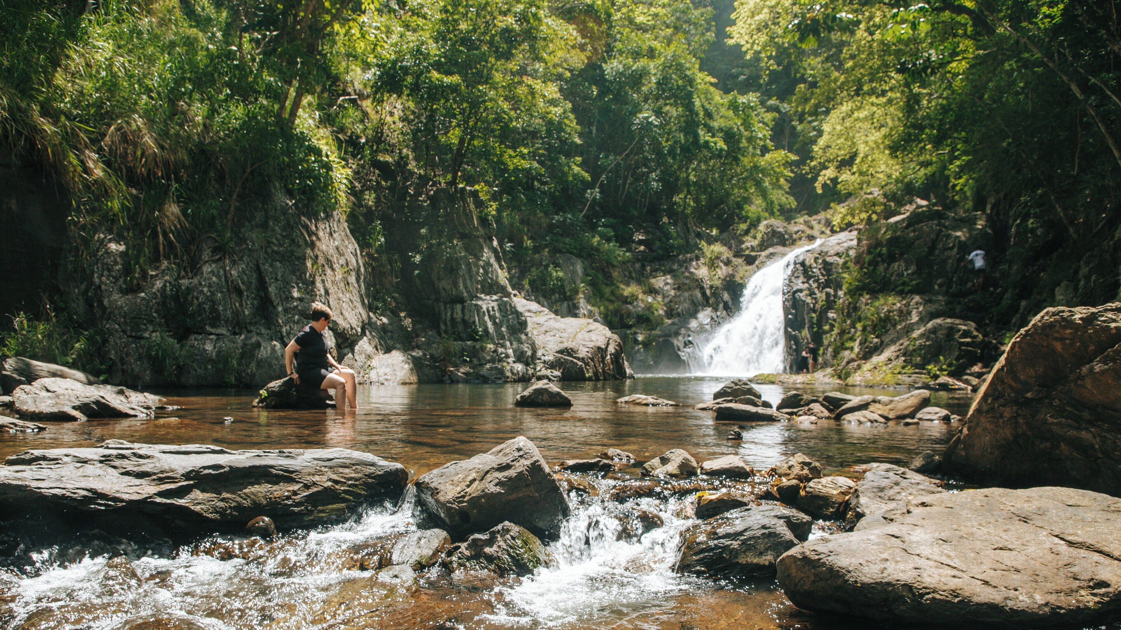 Exploring the tranquil beauty of Crystal Cascades in Redlynch, Cairns, Queensland, Australia on a sunny day