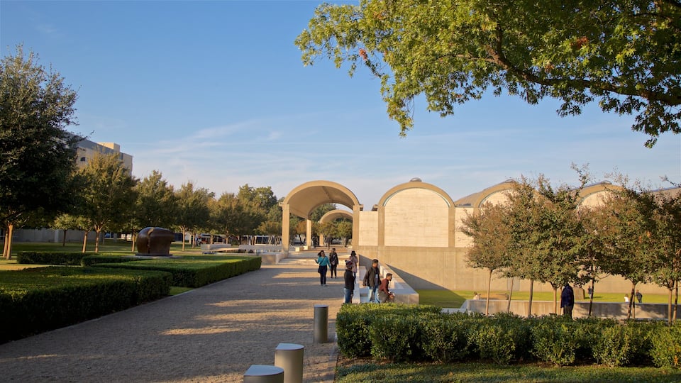 Kimbell Art Museum showing a park as well as a small group of people