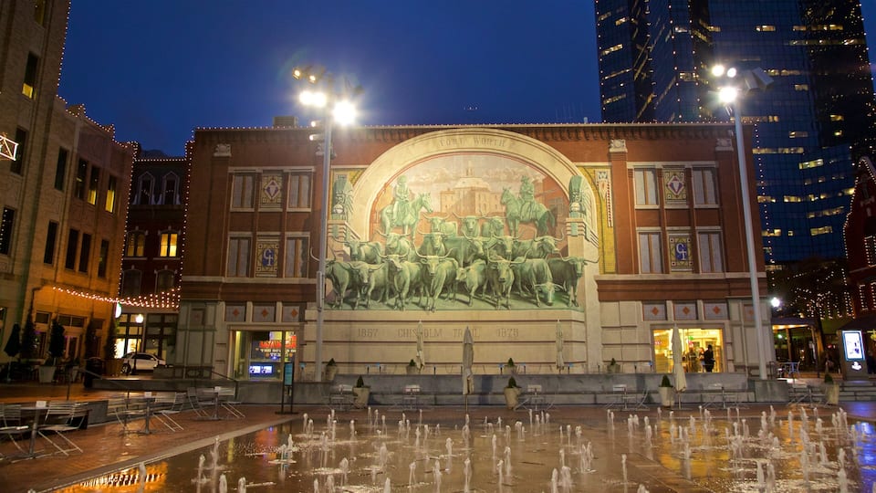 Sundance Square which includes a fountain, night scenes and outdoor art