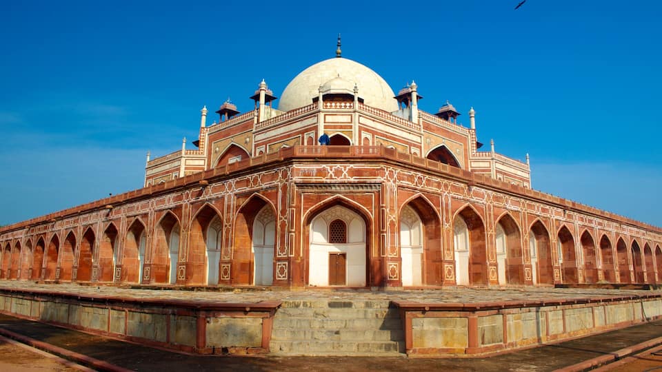 A large, domed building with intricate arches and a central doorway.