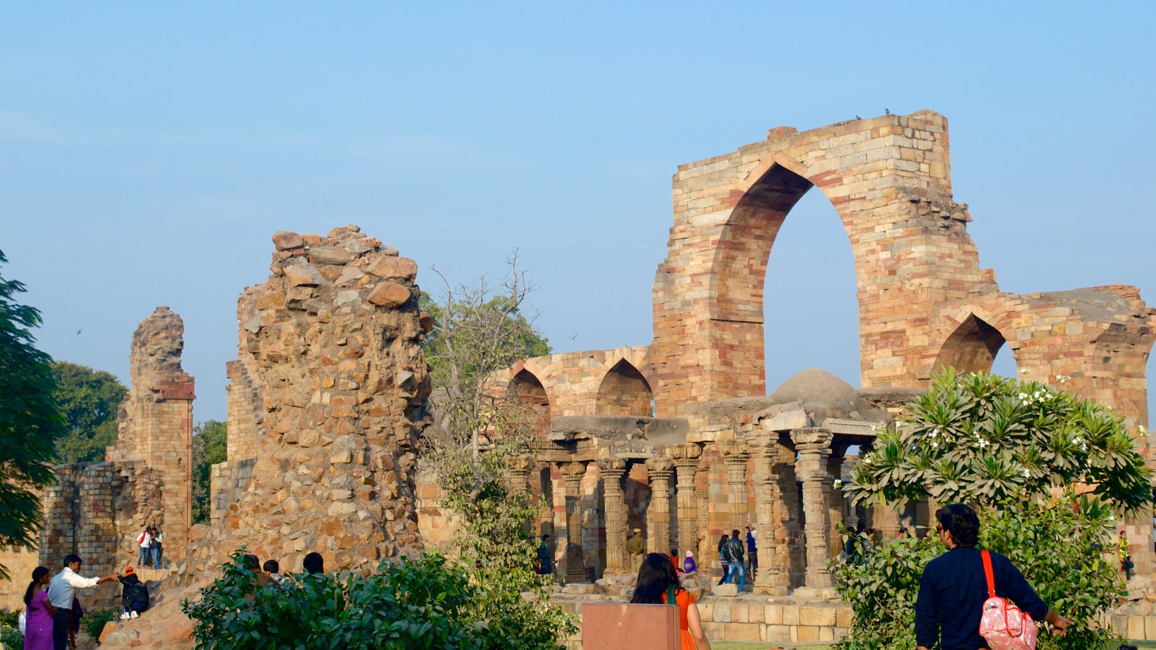 Qutub Minar showing heritage architecture and a ruin