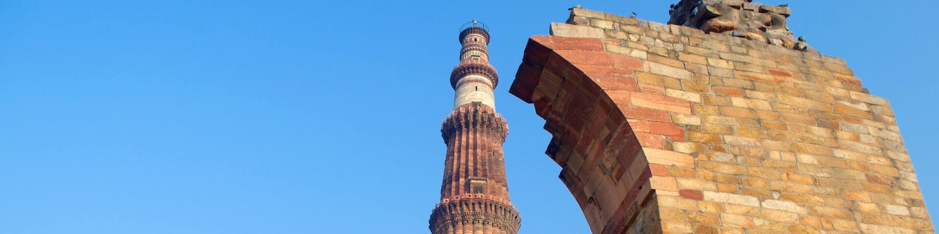 Qutub Minar featuring heritage architecture and building ruins