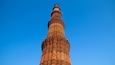 Qutub Minar which includes heritage architecture and religious elements