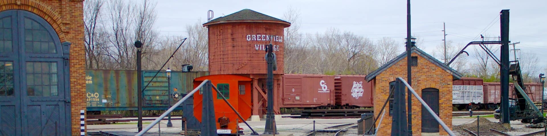 A railway bridge with tracks leading to a station.