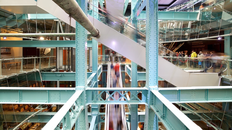 Guinness Storehouse which includes modern architecture and interior views as well as a small group of people