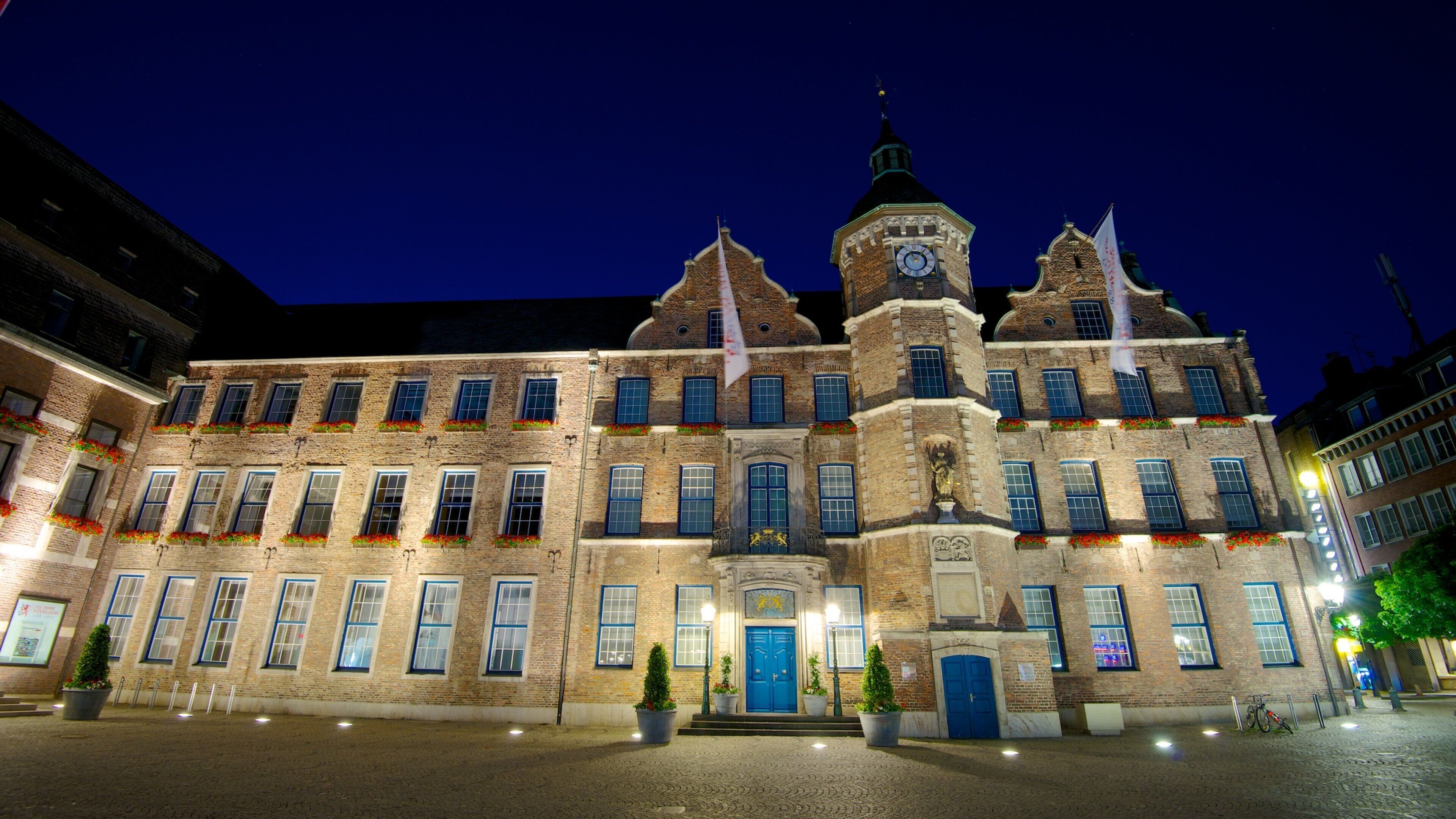 Duesseldorf City Hall showing an administrative building, heritage architecture and night scenes
