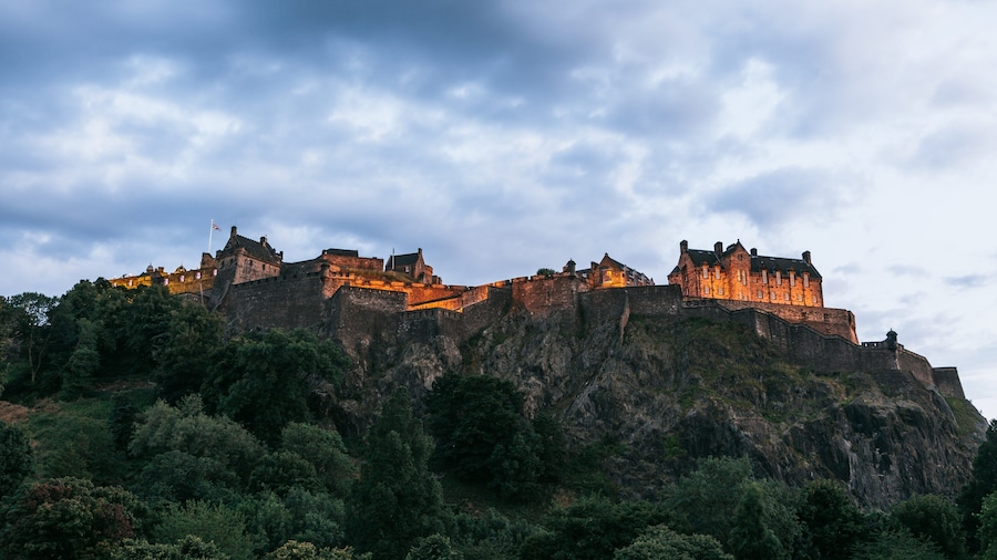 Edinburgh Castle featuring mountains, chateau or palace and heritage architecture