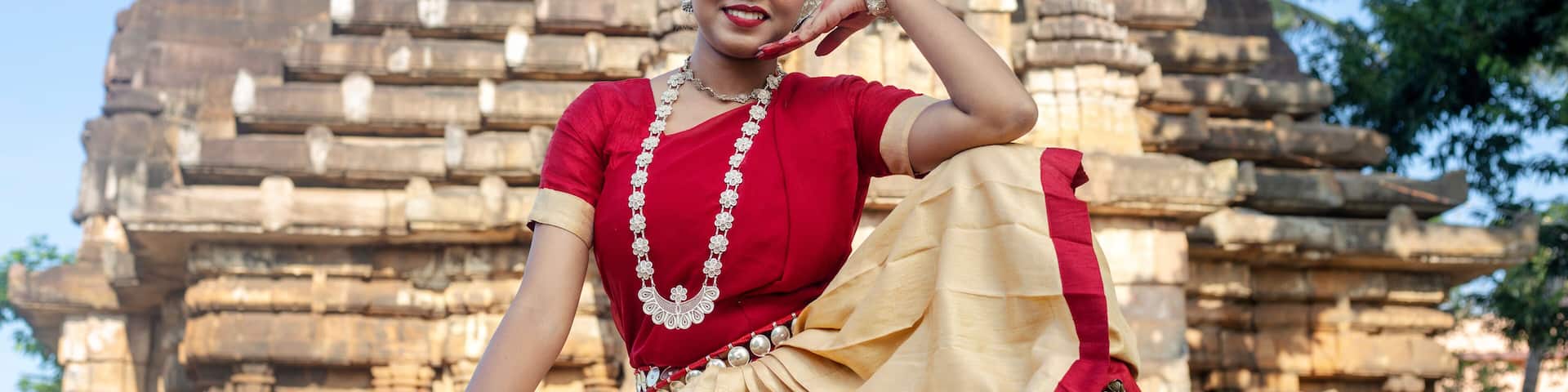 Beautiful indian girl dancer in the posture of Indian odissi dance at Parsurameswara Temple Bhubaneswar, Odisha, India.Indian dance