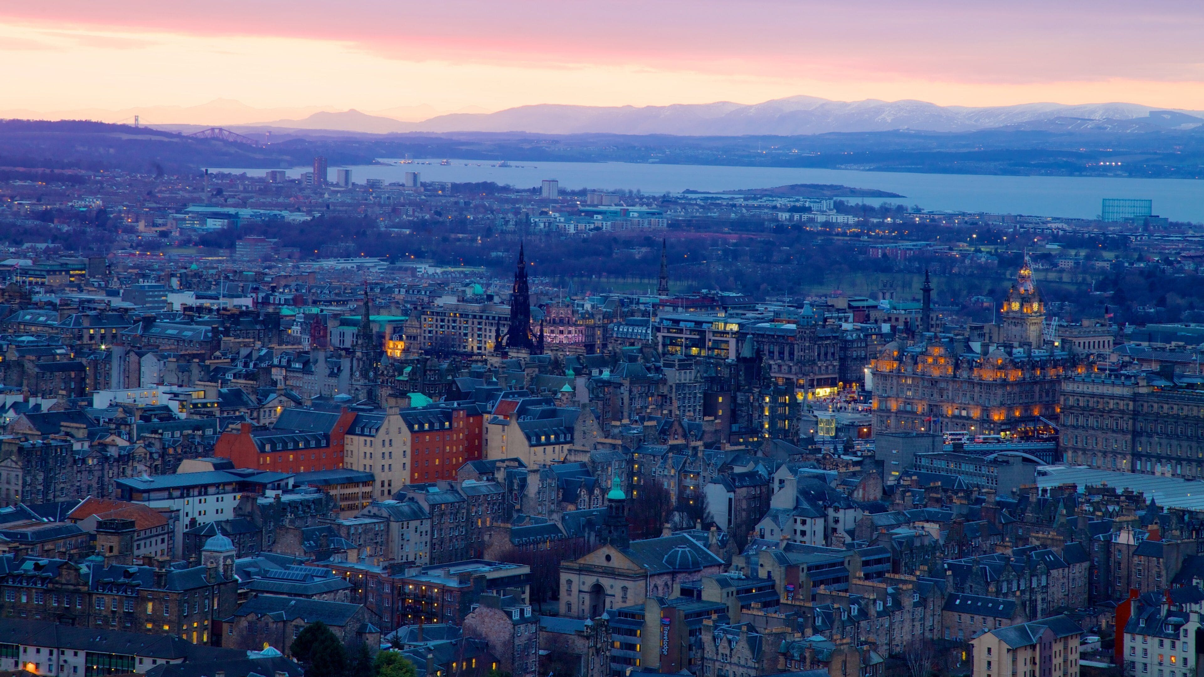 Arthur\'s Seat showing a city and a sunset